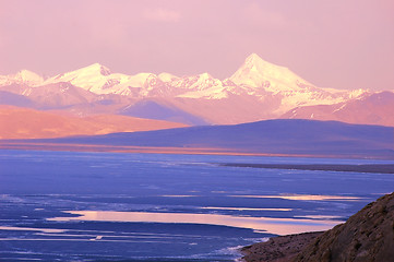 Image showing Blue lake and snow mountains at sunrise