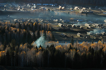 Image showing Landscape of a small village with woods in an autumn morning