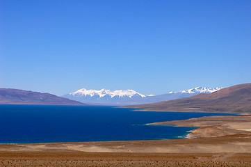 Image showing Landscape of blue lake and snow covered mountains