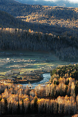 Image showing Landscape of a small village with woods in an autumn morning