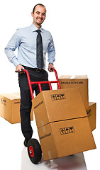 Image showing smiling man with handtruck