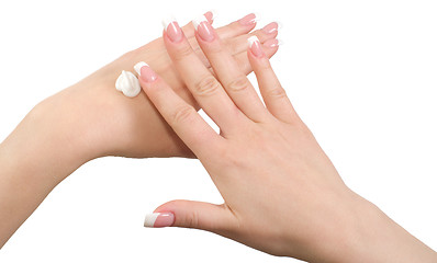 Image showing Applying hand cream.