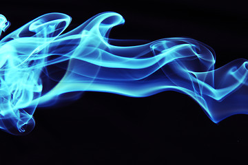 Image showing Stream of a blue smoke on a black background 