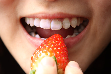 Image showing eating stawberry