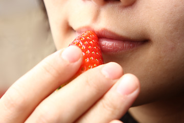 Image showing eating stawberry