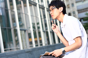 Image showing young man studying at outdoor