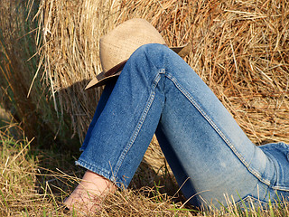 Image showing Legs with jeans in the field