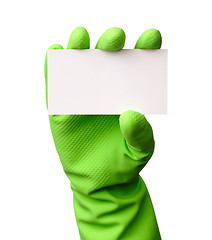Image showing Hand in green glove showing business card
