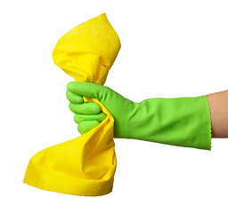 Image showing Hand in rubber glove holds cleaning rag