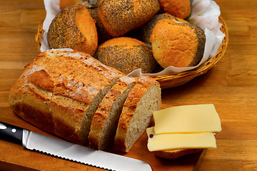 Image showing Fresh bread, bread rolls and cheese