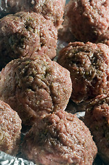 Image showing raw meatball in foil wrapped cooking 