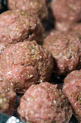 Image showing raw meatball in foil wrapped cooking dish