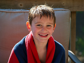 Image showing swimming boy wrapped in towel