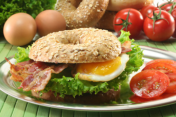 Image showing Bagel with fried egg and bacon