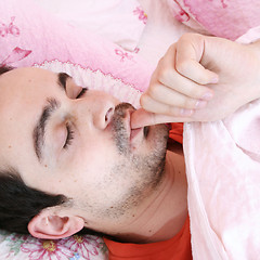 Image showing Young man sleeping .