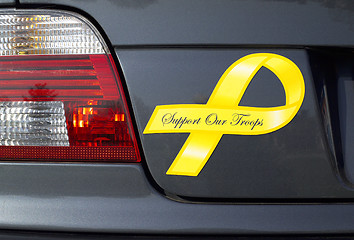 Image showing Yellow Ribbon magnet  on a European car - Support Our Troops