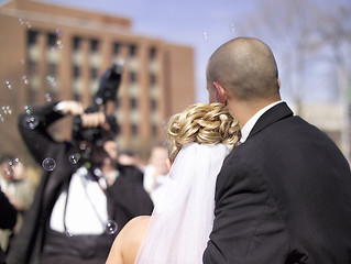 Image showing Wedding Couple - A photographer takes a picture of a bride and groom at a real wedding. 14MP camera.