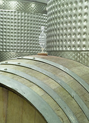 Image showing Wine Barrel and Vats - A modern winery cellar showing traditional wooden barrels and modern steel vats.