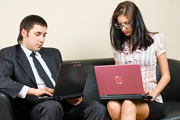 Image showing Businessmen with computers on sofa