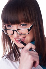 Image showing Girl biting pen