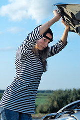 Image showing Young Blond Woman With Her Broken Car