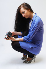 Image showing Young woman with camera