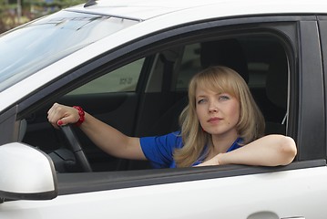 Image showing Young woman in car