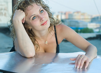 Image showing Young woman on roof