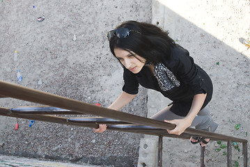 Image showing Young woman on roof