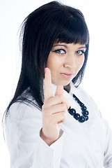 Image showing Attractive young woman with her finger up