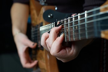 Image showing Playing on guitar