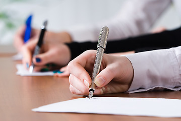 Image showing Signing women