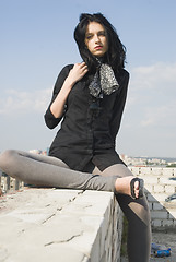 Image showing Young woman on roof