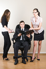 Image showing Businessman with assistants