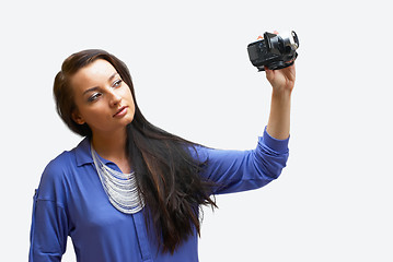 Image showing Young woman with camera