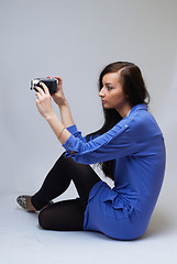 Image showing Young woman with camera