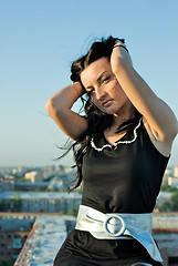 Image showing Standing girl on roof