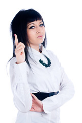 Image showing Attractive young woman with her finger up