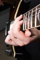 Image showing Playing on guitar