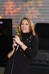 Image showing Woman with microphone