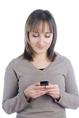 Image showing Girl writing sms
