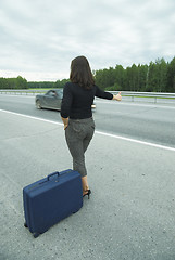 Image showing Woman with suitcase