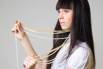 Image showing Woman with beads