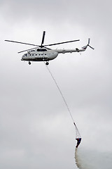 Image showing Helicopter over fire