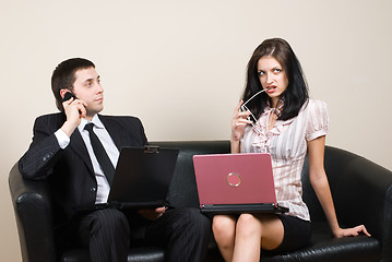 Image showing Businessmen with computers on sofa