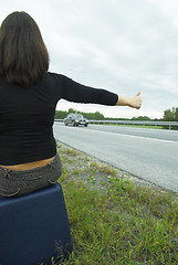 Image showing Woman with suitcase