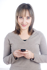 Image showing Girl writing sms