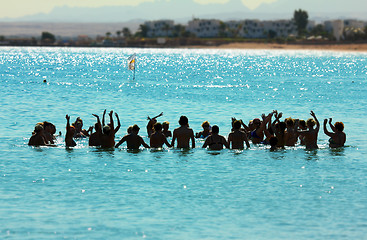 Image showing happy people do aerobics in sea