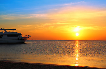 Image showing ship at anchor and sunrise over sea