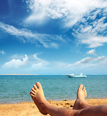 Image showing man foots on beach